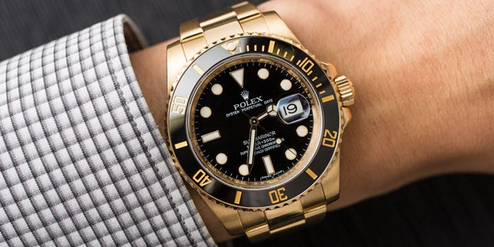 rolex gold and black watch