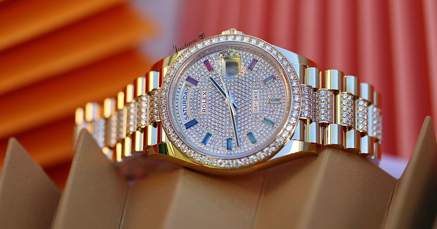 Rolex Day-Date 36 Yellow Gold Diamond Paved Rainbow Colored Sapphires Dial & Diamond Bezel Diamond Set President Bracelet-red-background-Jaztime Blog copy