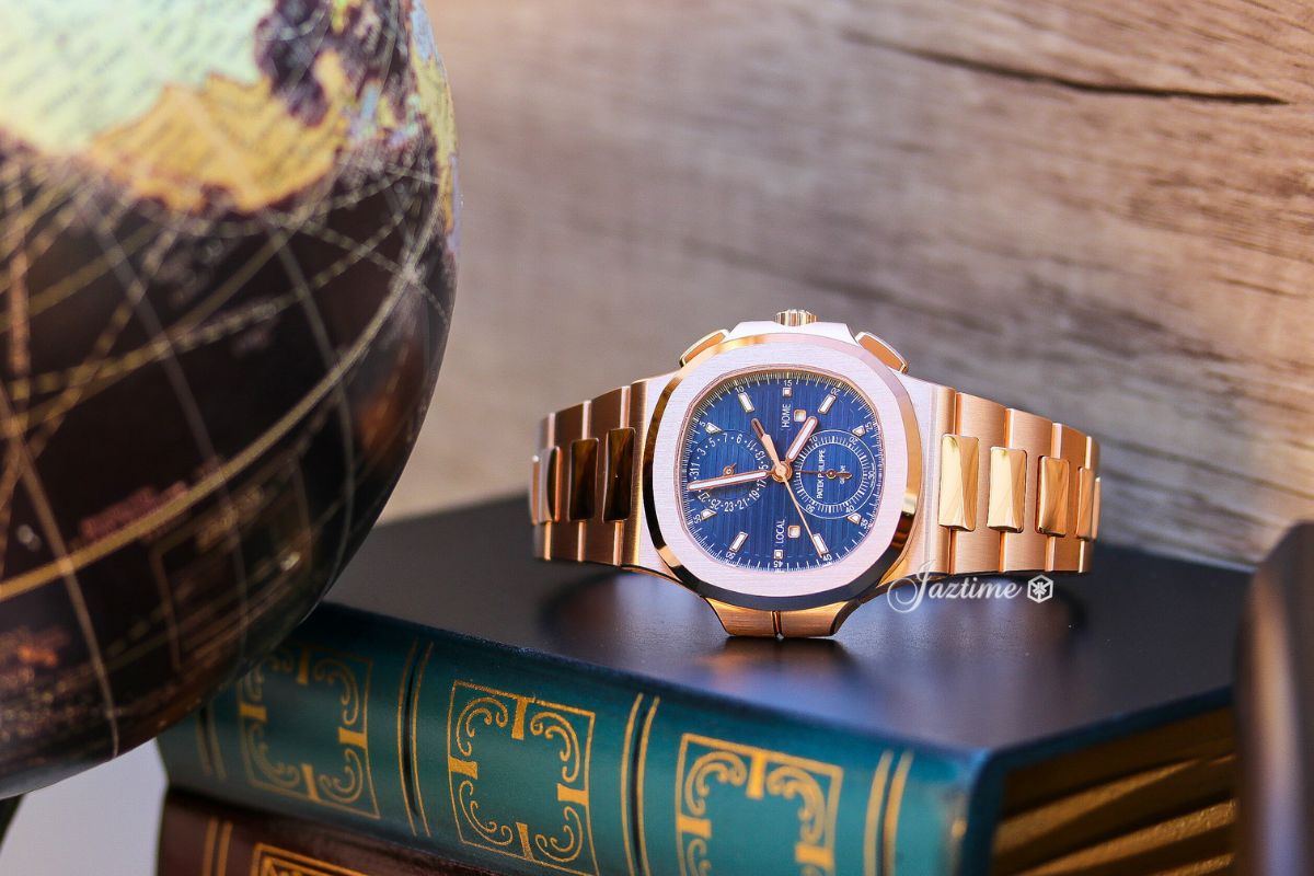 Patek Philippe Nautilus Flyback Chronograph Travel Time Rose Gold Blue Dial 59901R-001 - on top of a book - Jaztime Blog - New & Used Luxury Watches - Orange County