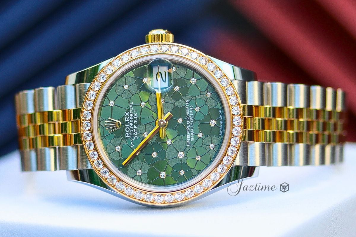 The dial of the Rolex Datejust 31 Yellow GoldSteel Olive Green Floral Motif Dial & Diamond Bezel Jubilee Bracelet 278383RBR - Jaztime Blog - New & Used Luxury Watches - Orange County - CA - Jaztime Blog